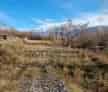Teren 2000 mp Valea Morii langa rau vedere munti